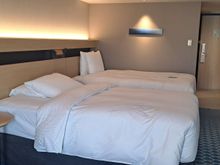 Better view of the room with the twin beds and hallway. Very good sized room
