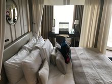 Bed seen from bathroom