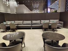 Seating area behing the restaurant tables.