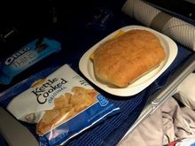 Child meal - turkey & cheese sandwich with chips, oreos and a sea salt caramel. 