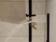 Gravity does not help for the shower head water pressure.