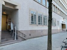 At the far left of the main entrance, one may find this side door with an elevator lift 