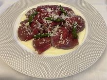 Beef carpaccio with truffle crème fraîche & asparagus