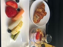 Bacon roll (which I found rather fatty) replaced with cheese/ham filled croissant. Delicious superfood pot and much better fruit plate.