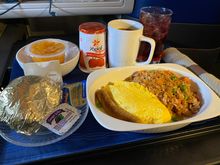 UA 200 GUM-HNL Breakfast three cheese omelette with fried rice and chicken sausage