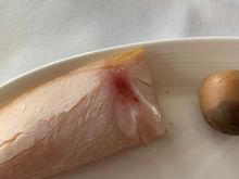 I'm sure that the red spot is just where they injected the "smoke flavour" into the meat but I ain't risking eating white meat with red spots on an aeroplane.