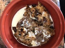 Leftover baked oatmeal with raisins, cream and brown sugar