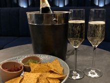 Nachos and champagne at Runway bar. 