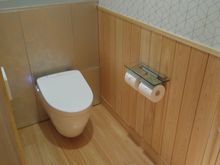 Small toilet room, near the entrance to the suite; i.e., about as far from the bedroom as it is possible to get. LOL