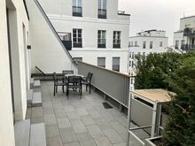 Total length of balcony seen from bathroom 1 past kitchen towards living room 