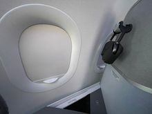 One (and a half, I suppose) windows, and a dedicated headphone holder. Headphones are available on request at the moment. 