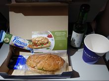Aug 2022, A3609, economy - hummus, rocket, and sundried tomato wholegrain baguette; Nestlé wholegrain fitness bar; white wine
