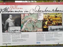 A board explaining the history of the village 