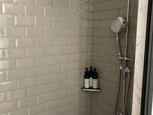 However this is only outfitted with a walk in shower stall . No tub here 