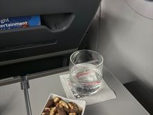 Feel like this is one of the only times my little bowl of nuts was not sad crushed pieces. Lime LaCroix to drink, had plenty of apple juice on my longer flight.