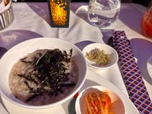 Beef and mushroom porridge with dried anchovies seaweed and kimchi - this was excellent 9/10.