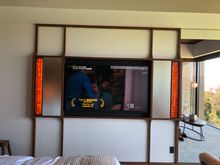 60" LCD TV with orange stained glass at each end