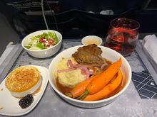 Dinner of beef short rib, seasoned mash with pickled red onion, and honestly gigantic carrots. Side salad and mango mousse cake 