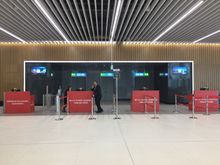 Gate G2 with fresh flowers awaiting departing passengers