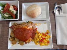 I preordered the Piri Piri Chicken. It was a boneless, skin on breast. It was described as spicy, but it was pretty mild. The corn was excellent. The potatoes were good. The salad, with pesto and fresh mozzarella and tomatoes was the highlight of the meal. I wish that could have been the main dish. It was excellent. The bread was soft and tender. 