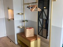 Left of the entry is the open wardrobe space