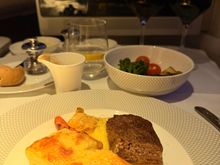 Well done steak; the potato gratin was nice. 