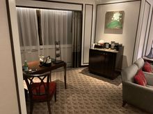 Immediately as you turn left, you have a desk as well as section for fridge/coffee/water