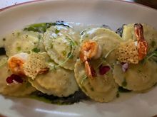 Ravioli King Prawn & Lemon O
Homemade ravioli filled with prawn and lemon zest, served with squid ink sauce 230K