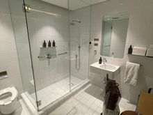 Shower Number 1: Quantas F lounge. Tiles are abit old in design, but did the trick. Wished there was more space or luggage rack to put the luggage on. There is an ottoman though, and did the trick!