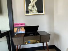 You can grab a record from their collection. 
I ought to clarify that the Kenny G album was already in the room.
