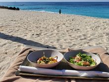 Lunch on the beach, squid skewers and side salad