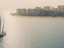 James Bond sailing to Gunkanjima in Skyfall