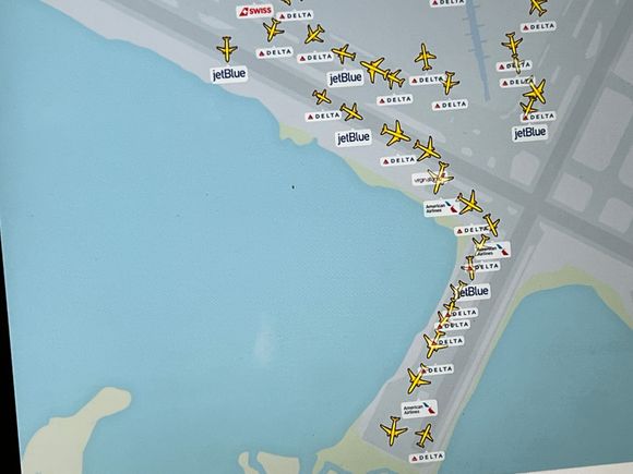About 22 flights lined up at 7:48 p.m. Lounge has emptied considerably.