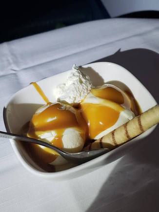 High Road Vanilla Ice Cream Sundae with caramel and whipped cream
