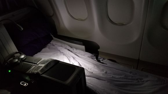 Fully reclined seat with makeshift mattress pad