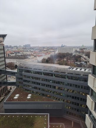 View from my room ( some reflection from my mobile phone camera). Karlskirche to the right ( beautiful at night when lit) and Belvedere to left