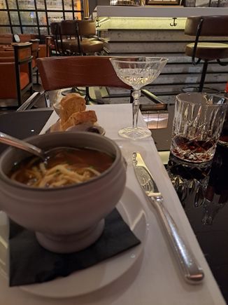 Beef consume at Emile's ( EUR 42 for three courses) Wide but shallow prosecco glass at rear