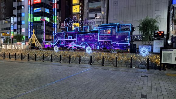 West entrance to Shimbashi station ( colours change with music regularly)-santa driving the train!