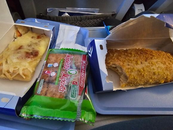 On the left... The kid's menu! Pizza (Margherita I believe). Miranda biscuits for dessert.
On the right... One of two options for everyone else. This is the (cheese pie?) "tiropita" (which was actually nothing like your typical Greek tiropita, it even had ham inside, but I still enjoyed it, along with the Pizza, which had a dough a bit on the tough side for children).
The other option was spanakopita (yeap, spinach pie), which neither of us tried nor did I see anyone around us selecting... 