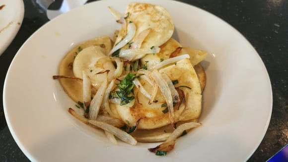 Sautéed pierogies with onions. I believe it's against the law to go to PA and not have pierogies.