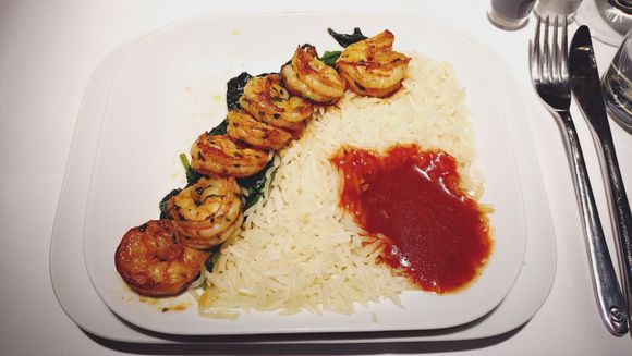 Main Course: Prawns on a Bed of sautéed Spinach with Tomato Sauce and Basmati Rice