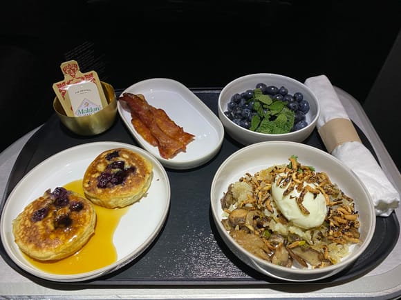 Clockwise from top right: macerated blueberries, 6-minute egg, blueberry quinoa pancakes, and maple glazed bacon.