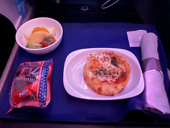 Cheese pizza an hour before arrival… other option was the couscous with veggies.  Really pathetic attempt at a business class meal.