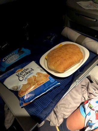 Child meal - turkey & cheese sandwich with chips, oreos and a sea salt caramel. 