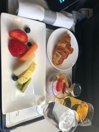 Bacon roll (which I found rather fatty) replaced with cheese/ham filled croissant. Delicious superfood pot and much better fruit plate.
