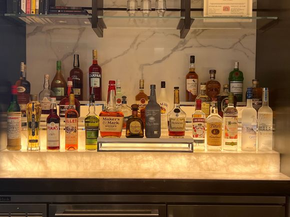 Was told no cocktail menu yet due to change in vendors (not sure how true that was).  Was told only one type of gin (Tanqueray) but it didn’t taste like it…
Here’s a pic of the liquor shelf…