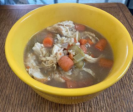 Chicken and rice soup with onions and bad carrots and bad celery. 