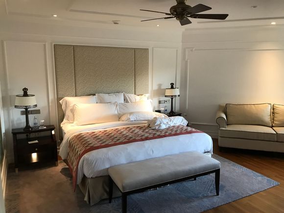 Bedroom with ceiling fan and alarm clock