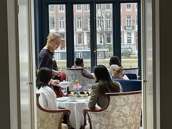 Ladies at afternoon tea in the conservatory