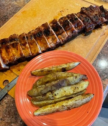 Grilled baby back cribs and crispy potato wedges